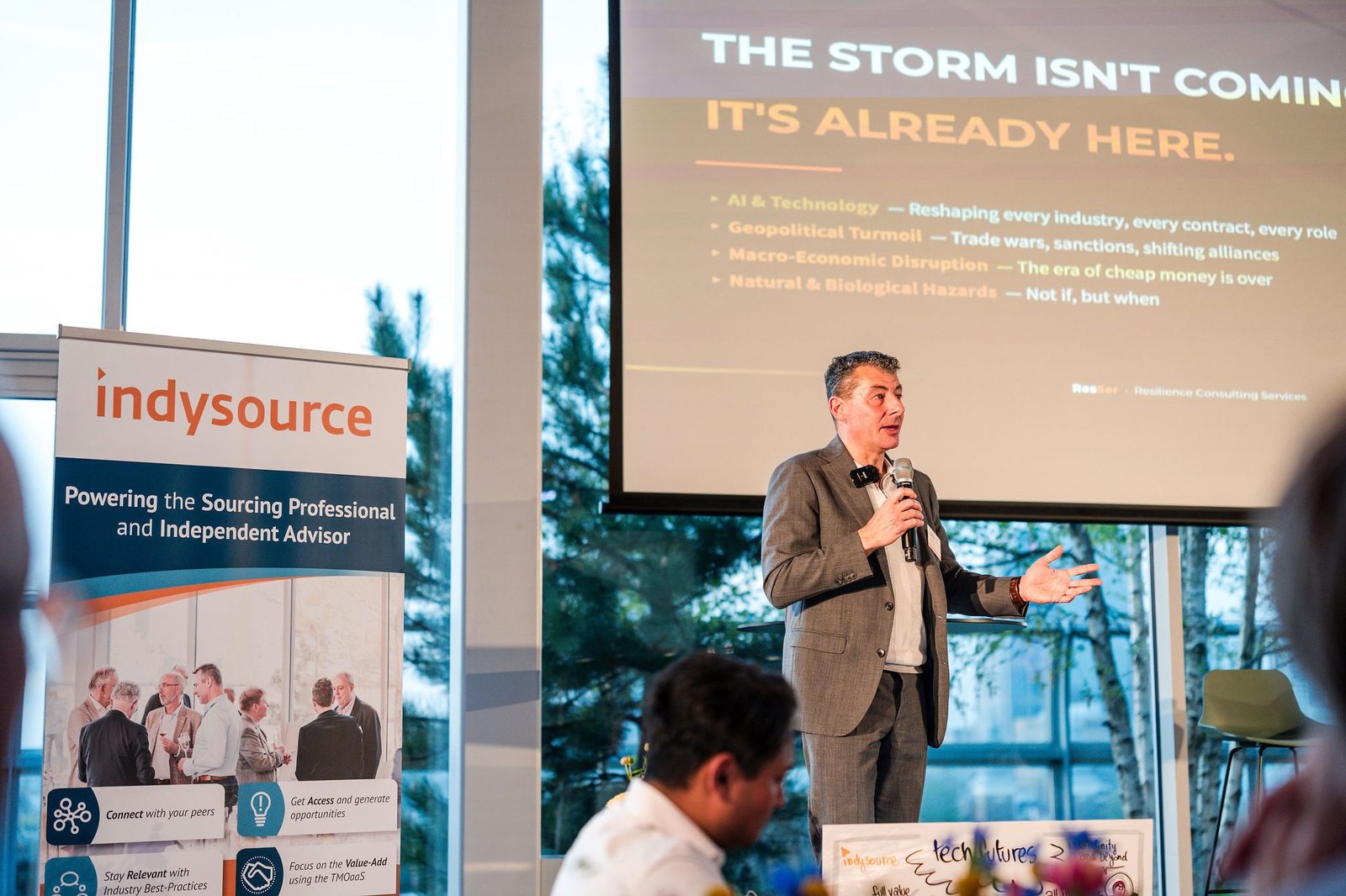 Marcel Mertens presenting 'The storm isn't coming. It's already here.' at the IndySource Annual Event 2026